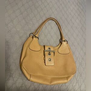 PRADA bag high-quality beige leather, elegance blends=casual and formal attire.